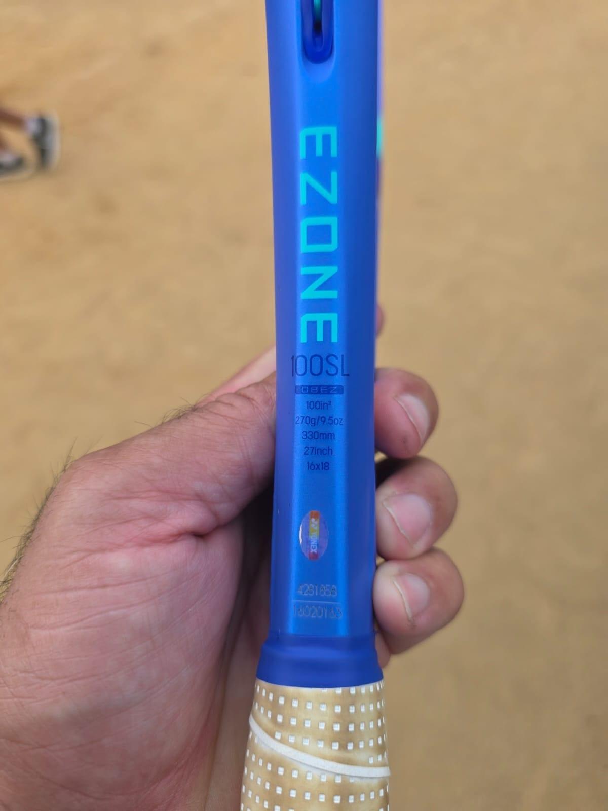 Close-up of Zacharia's Yonex EZONE 100SL racket throat showing its specifications